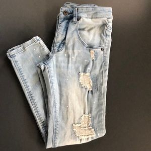 Boys skinny destroyed jeans with paint spots